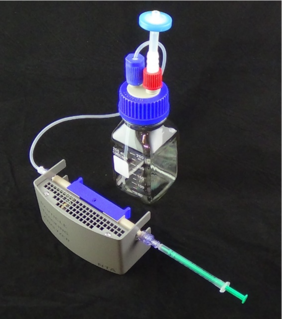 Standard NTA Cell Assembly with blue cell holder, sample syringe and waste outlet. Standard NTA Cell Assembly with blue cell holder, sample syringe and waste outlet.